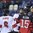 POPRAD, SLOVAKIA - APRIL 17: Switzerland's Nico Hischier #13 and teammate Axel Simic #6 get into a scrum infront of the net with Canada's Kyle Olson #15 during preliminary round action at the 2017 IIHF Ice Hockey U18 World Championship. (Photo by Andrea Cardin/HHOF-IIHF Images)